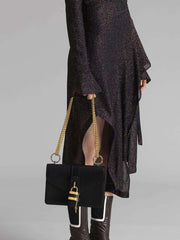 Aby Chain Shoulder Bag in Shiny Goatskin holding